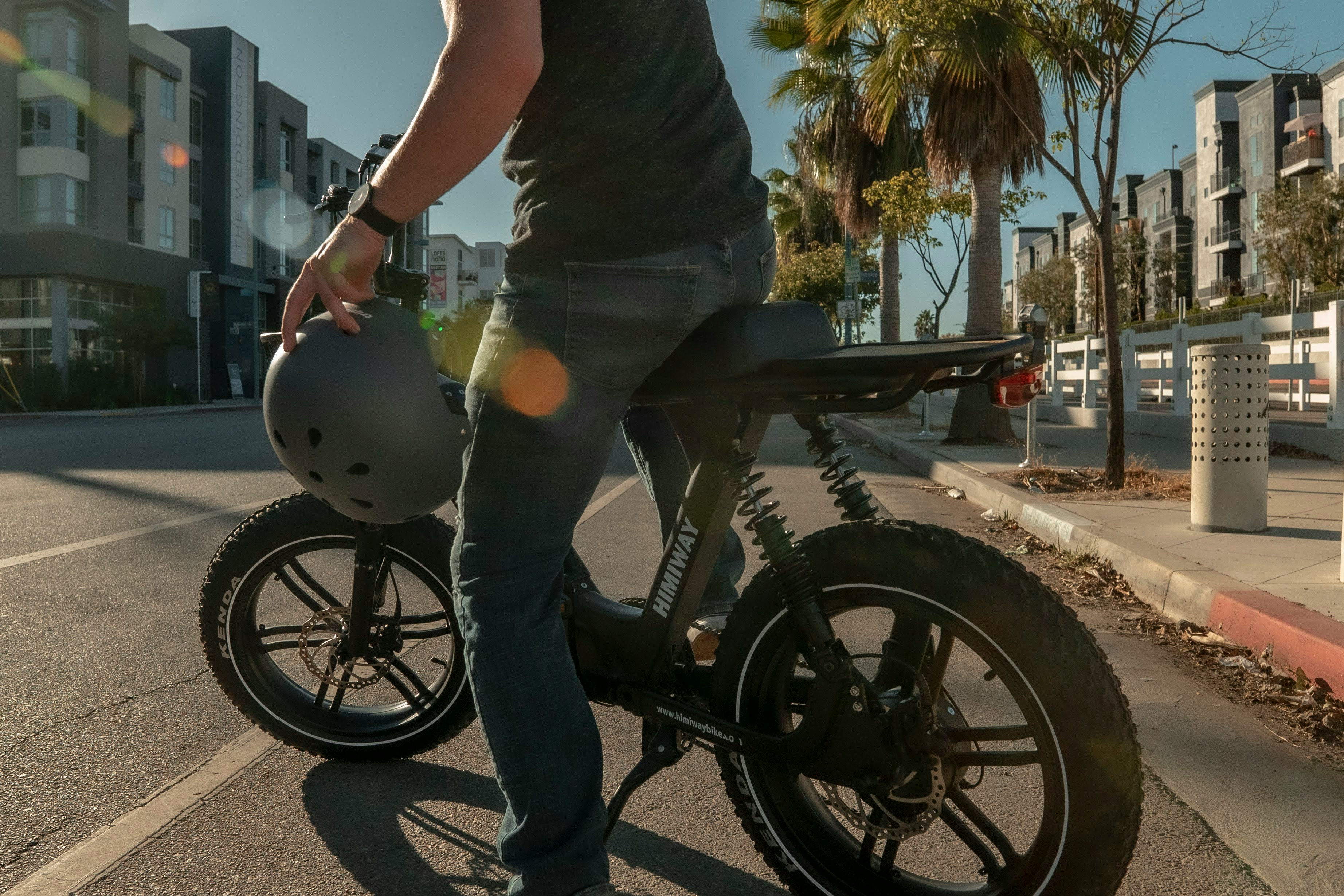 man in black t-shirt riding black motorcycle